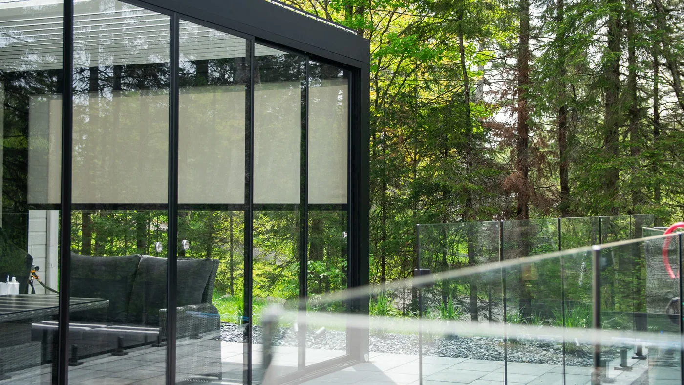 View of the Capri pergola from the pool, landscaped backyard in Lac-Beauport
