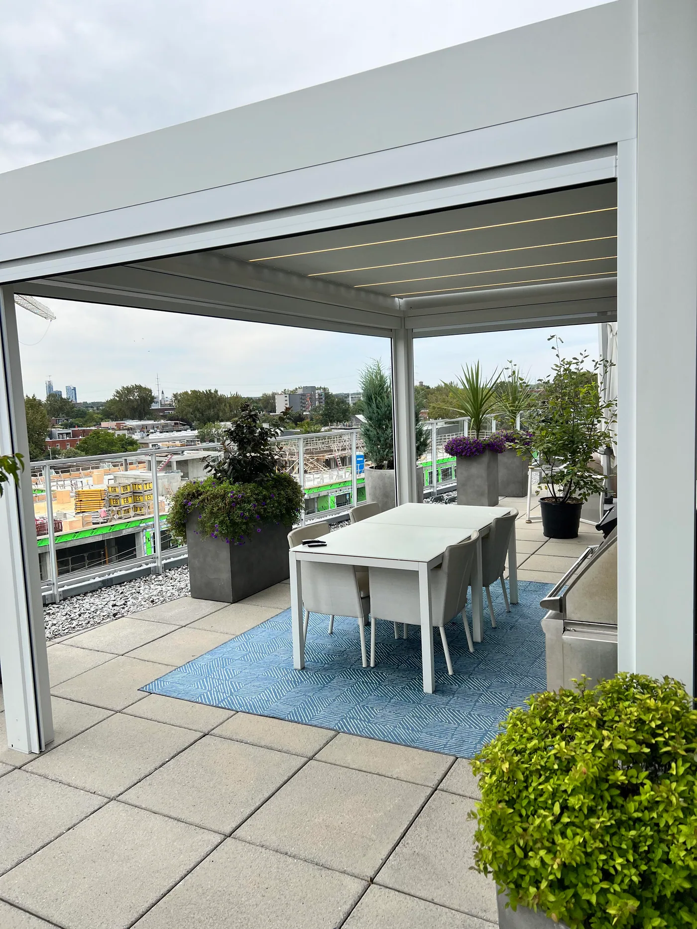 Panoramic view over Montreal from the rooftop terrace sheltered by the Provence pergola