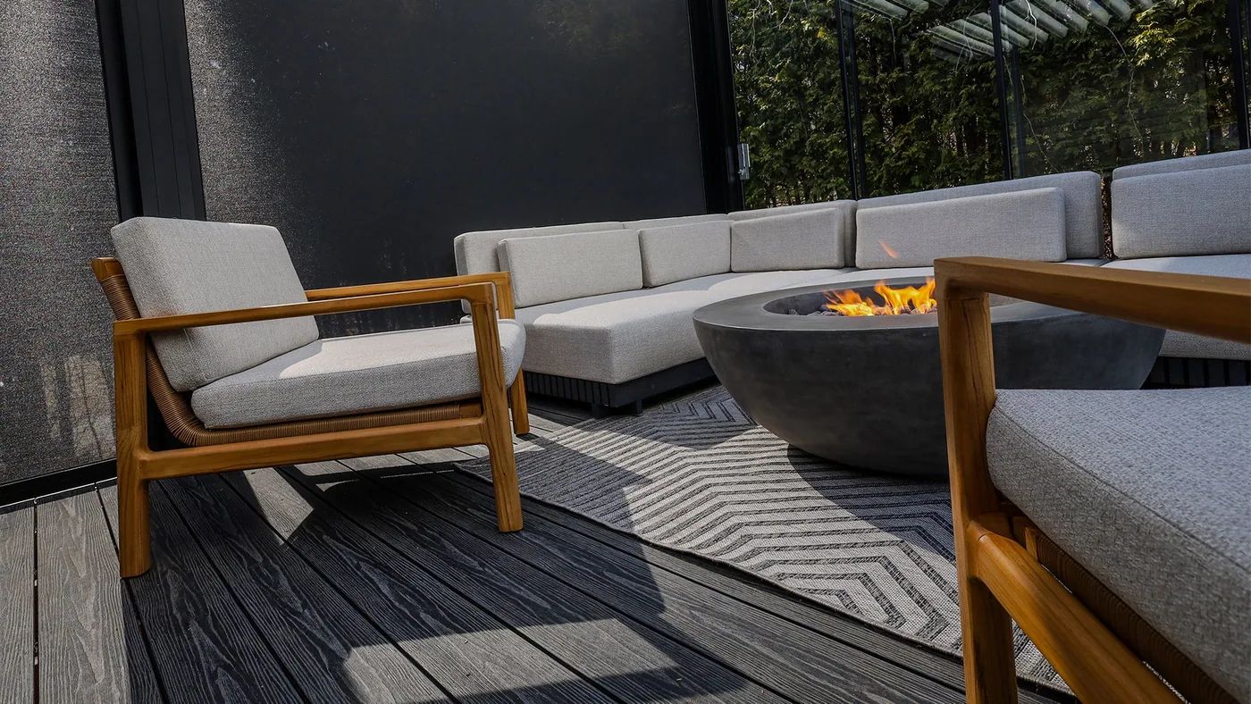Sofa and outdoor chairs under the Capri pergola of the Harvey project