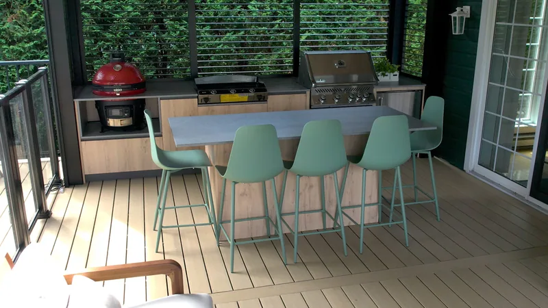 Outdoor kitchen of the Tremblay project, in a warm wood finish with an Orastone stone countertop