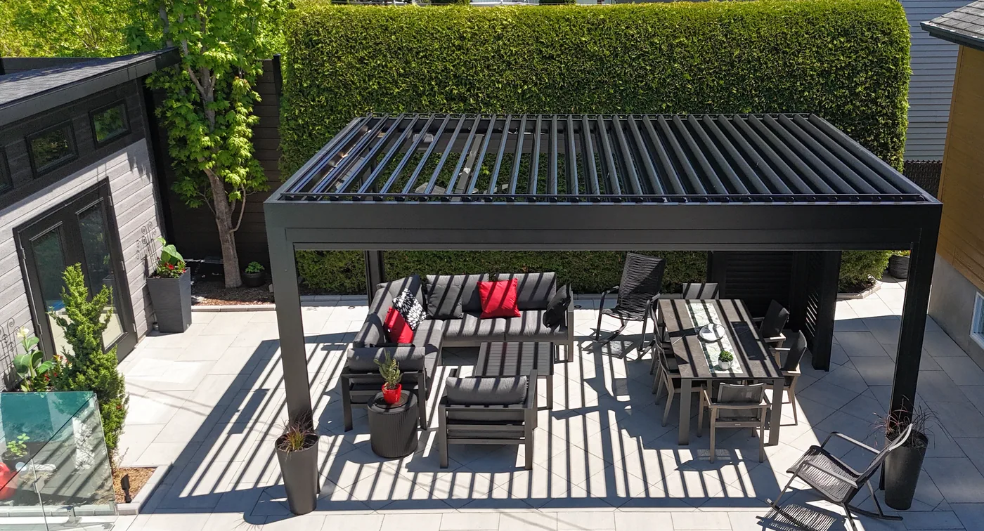 Overhead view of the Capri pergola: roof louvres part open above the terrace furniture